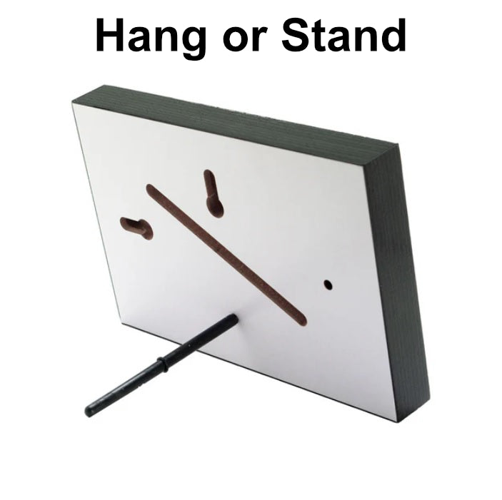 a photo on a wooden photo block, hand or stand.