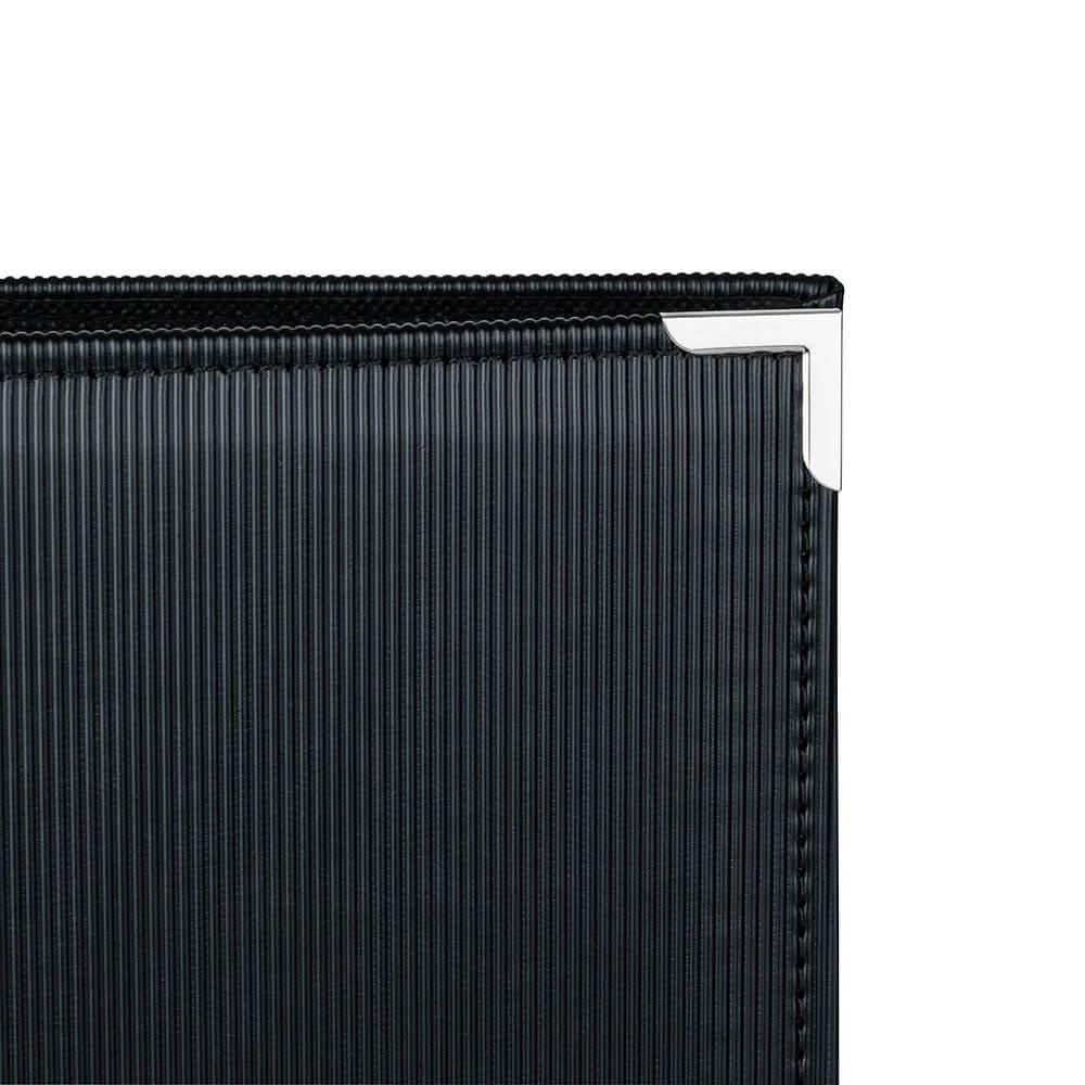 Detail of front cover, metal edge detail, of cheap photo albums in Ireland.