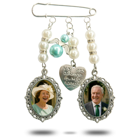 Brooch with heart-shaped charm and photo frames on a white background