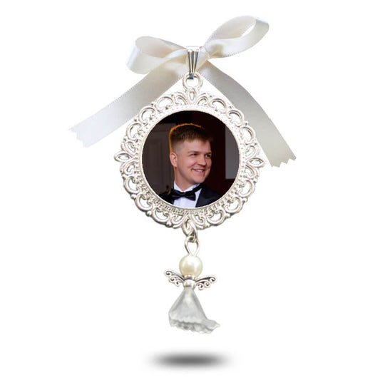 Decorative circular filigree wedding charm with a photo and featuring an angelic design.