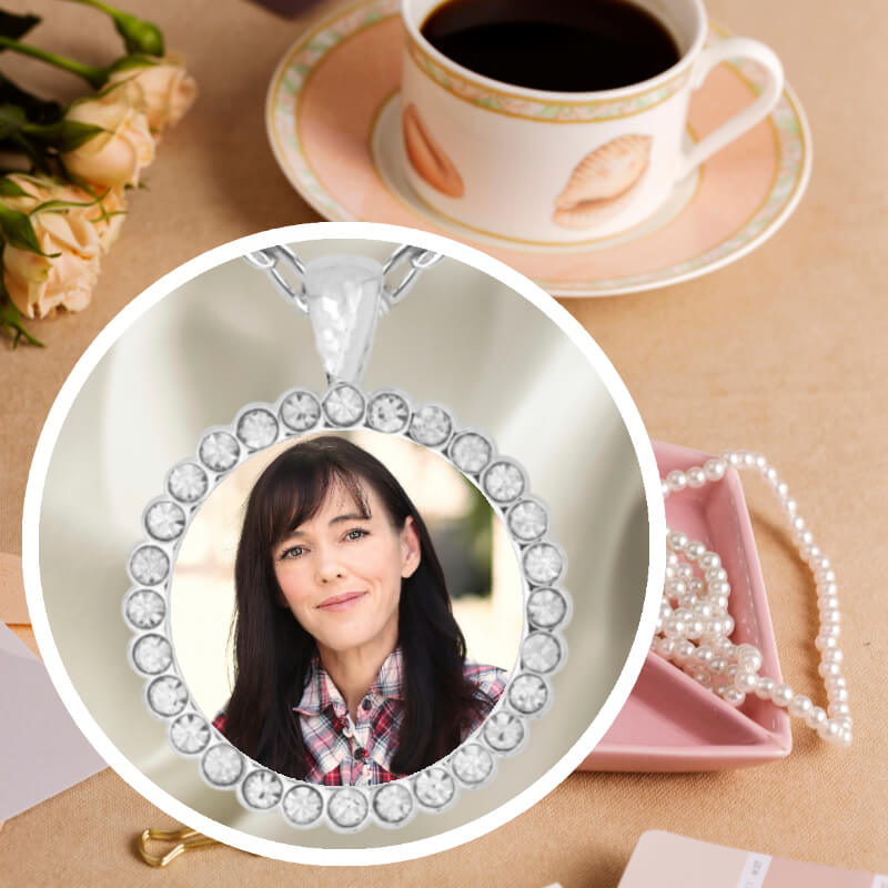 Circular rhinestone necklace with your picture on a silver chain. Keep someone you love close to your heart.