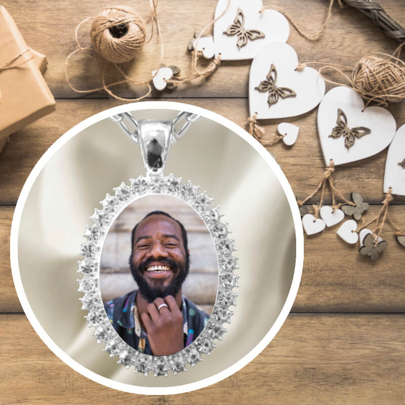 Photo locket necklace, oval shaped, in a rhinestone setting, on a silver chain. Fast delivery in Ireland.