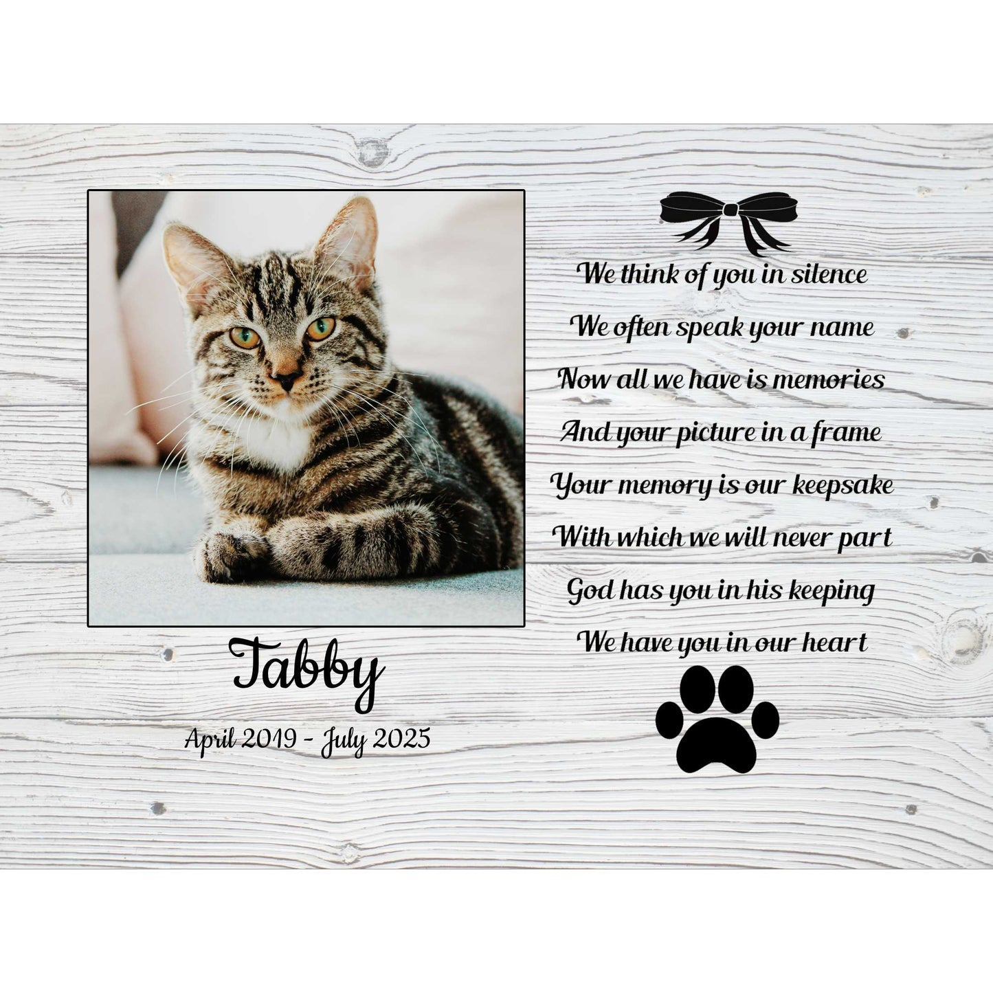 Pet memorial photo block framed plaque for a cat named Tobby with a photo of a tabby cat, text, and paw print on a wooden background.t m
