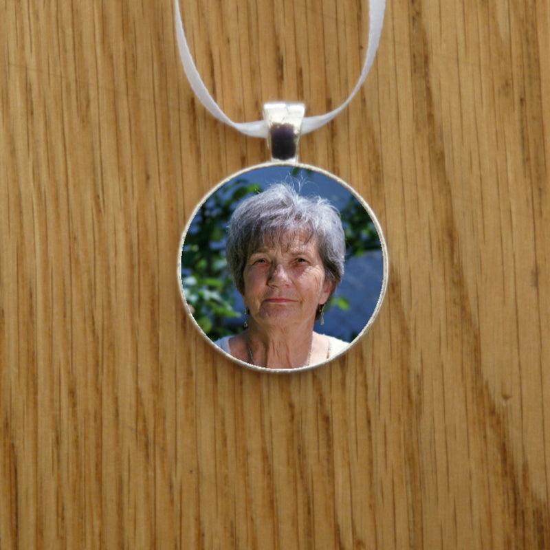 You can remember two loved ones with this double-sided wedding memorial charm.