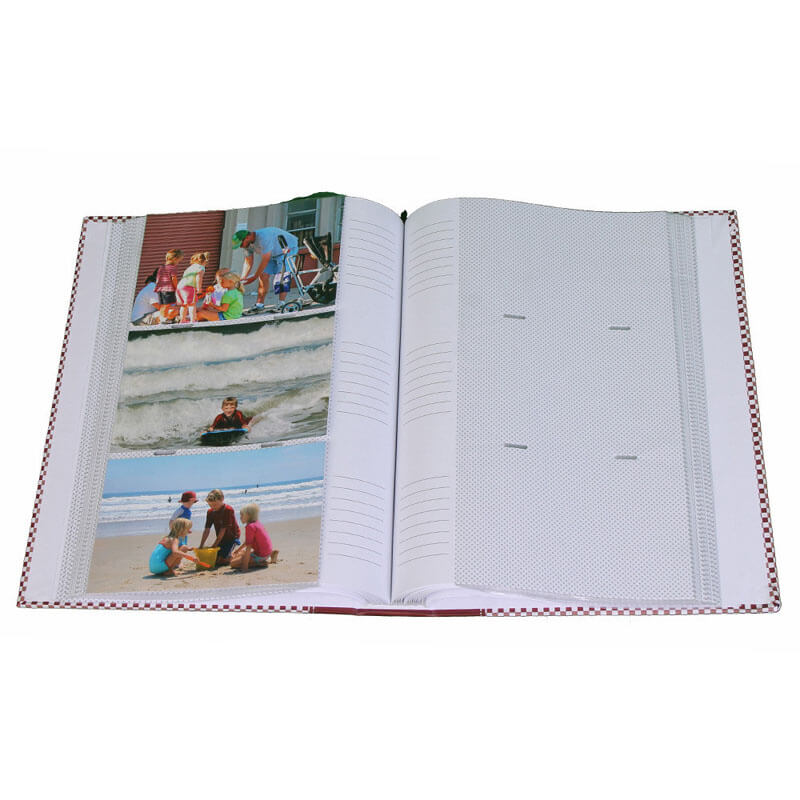 Open photo album with family photos on a white background