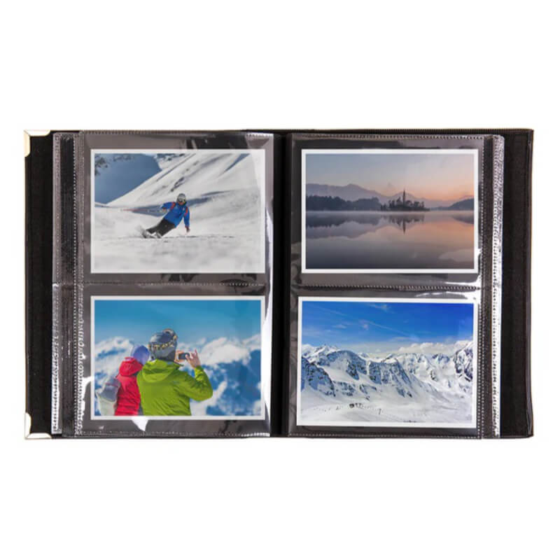 Photo album with four scenic winter photos on a white background
