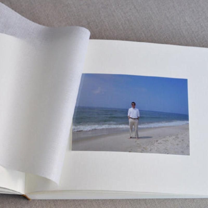 A traditional plain page  wedding photo book album with tissue interleaves.