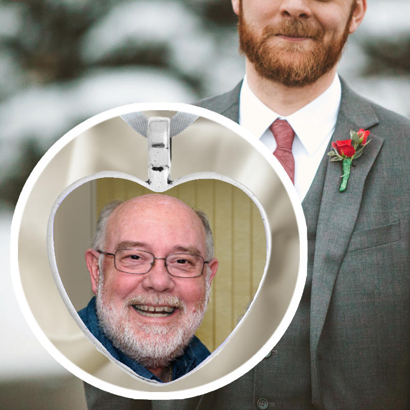 The groom's memorial pin with a photo of a lovedone in a plain silver heart. Hamd made in Irleand with fast delivery.

