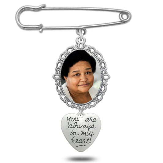 Personalised silver wedding bouquet photo charm with intricate lacy oval frame and inscribed heart pendant.