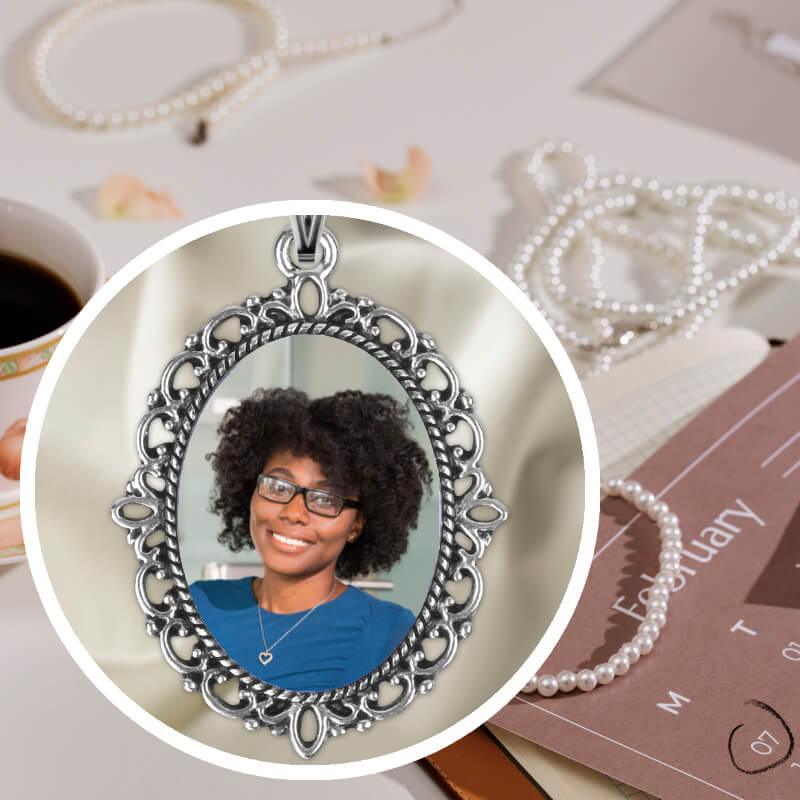 Silver locket necklace with a picture inside to preserve memories.