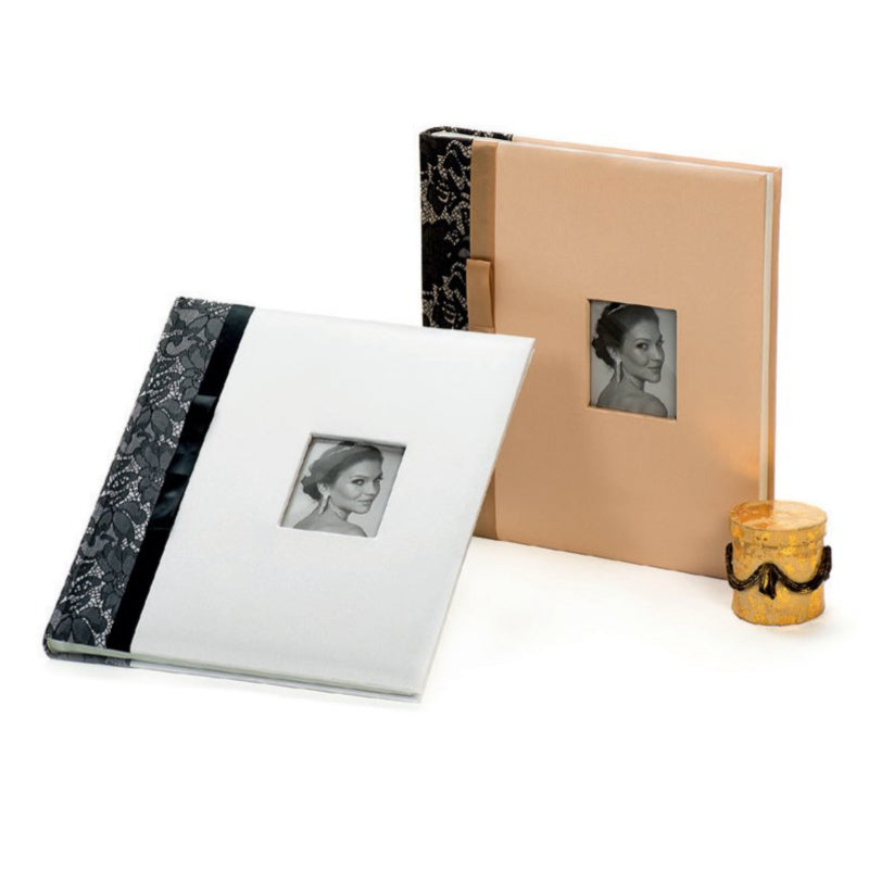 Two wedding photo albums with marble and beige covers, featuring black and white photos of a woman, on a white background.
